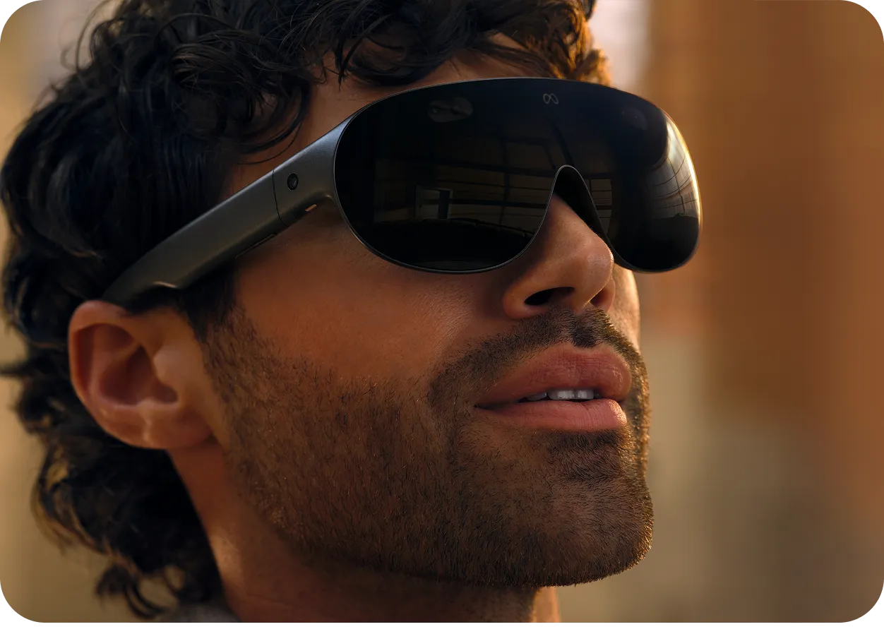 A person targeting an interface with their gaze and pinching to select