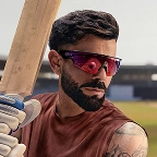 A man modelling the Oakley Meta Vanguard glasses with Matt Black frame and Prizm™ Road lens.