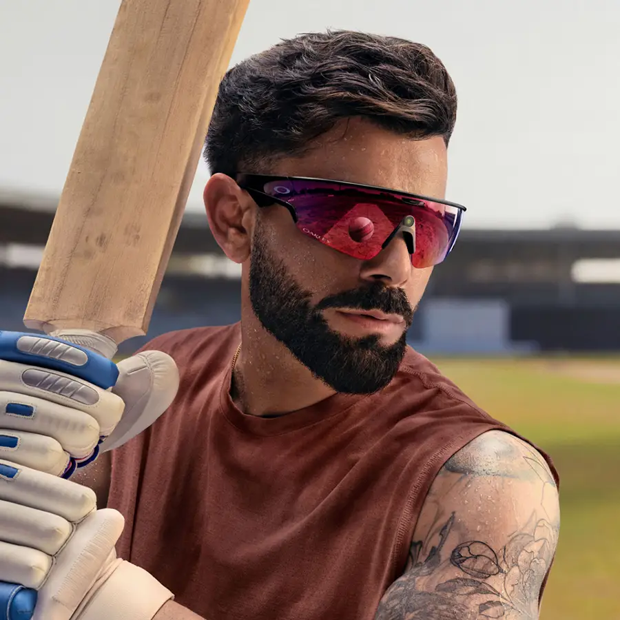 A man modelling the Oakley Meta Vanguard glasses with Matt Black frame and Prizm™ Road lens.