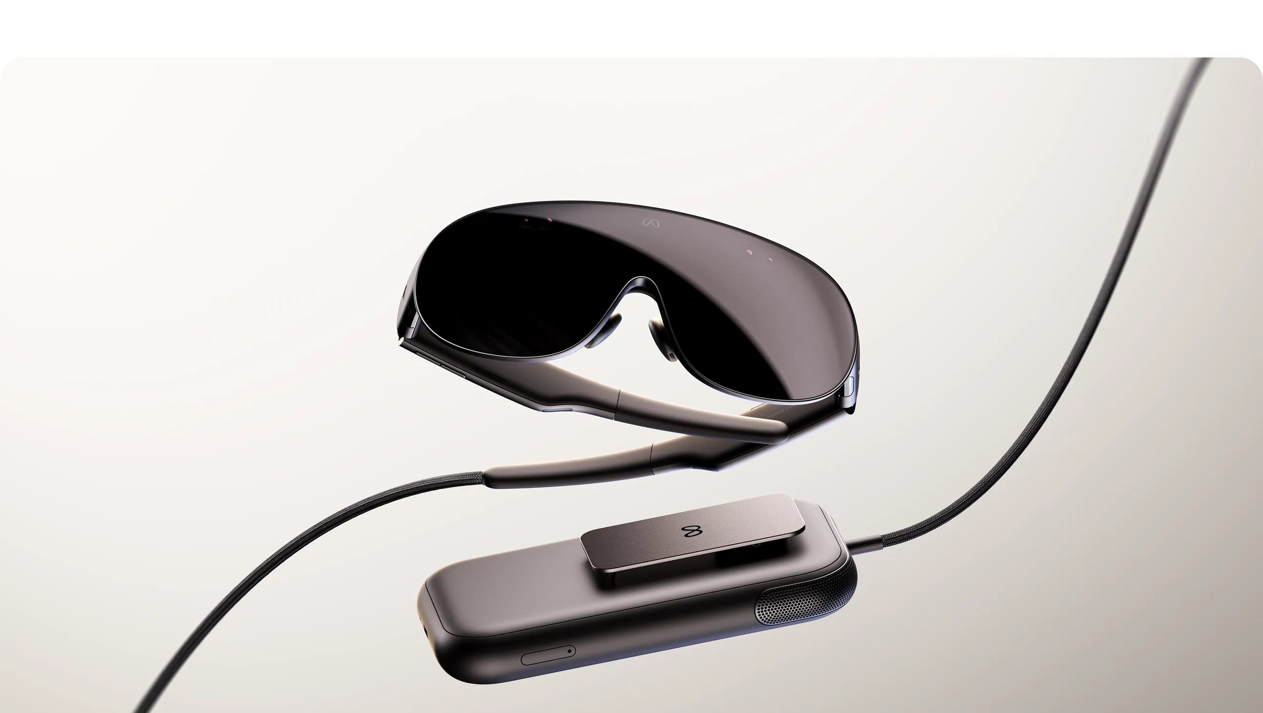 Meta VR Glasses beside a compact compute puck