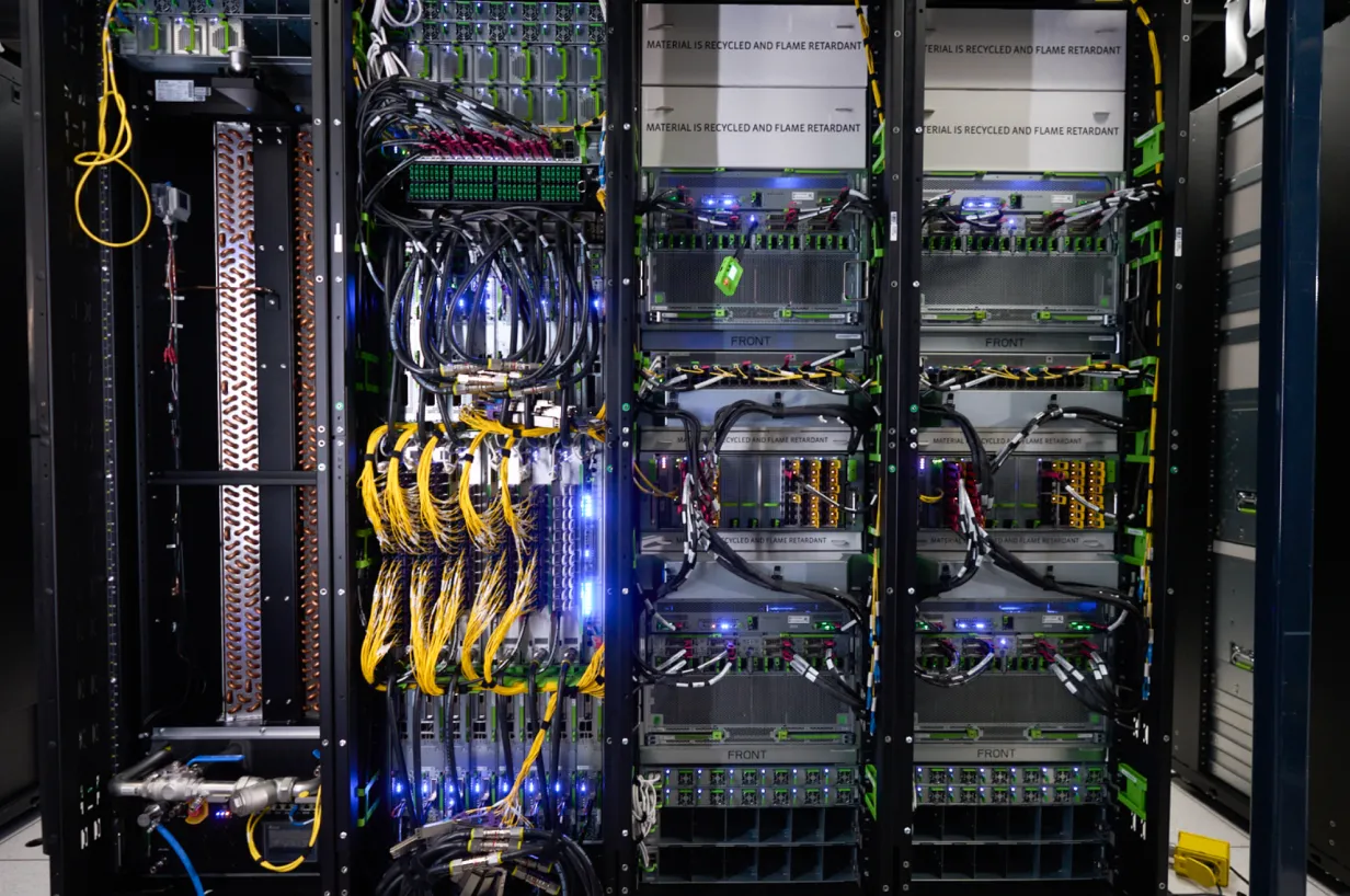 Technical sourcing manager Fangran X. collaborating with a Meta teammate in a lab.