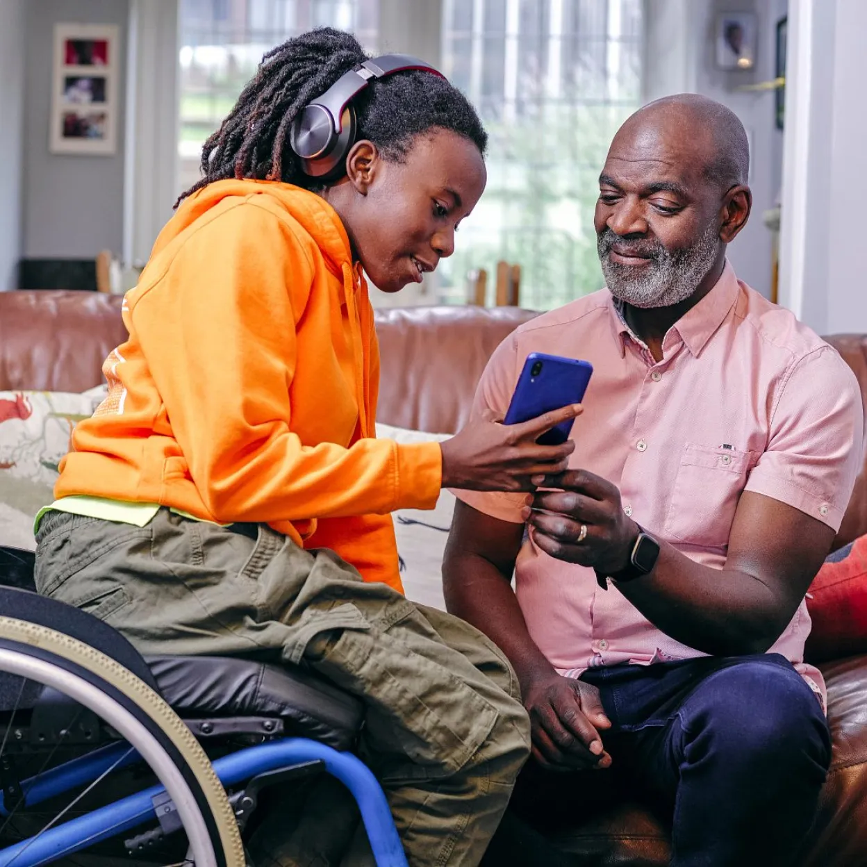 
      	A teen and her parent explore social media features and tools on her smartphone.
      
