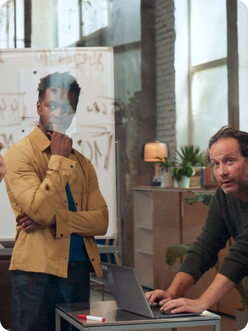 Workers collaborating in meeting