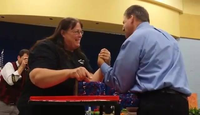 EXECUTIVE Councilor Chris Sununu arm wrestling with World Champion Arm