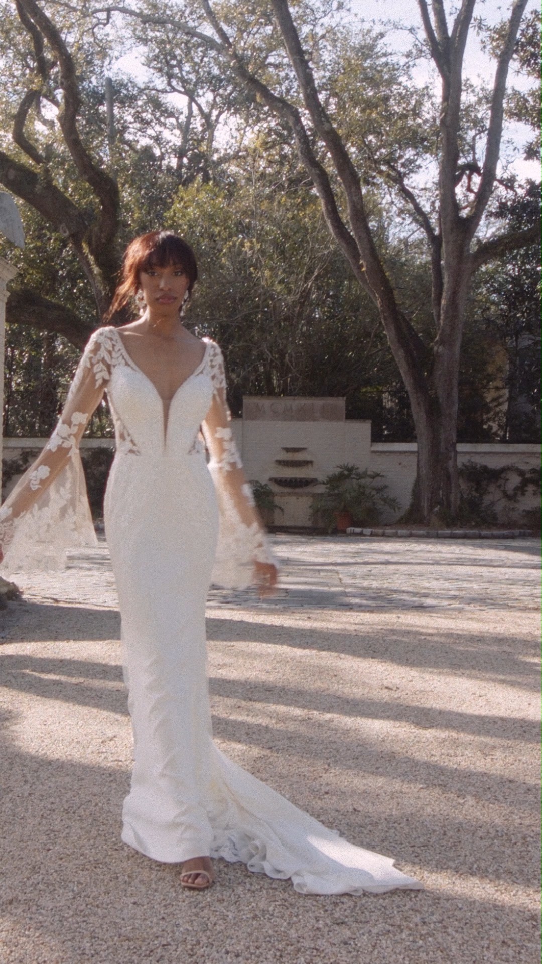 ferrari formal wedding dress prices With bell sleeves as delicate as the wings of a butterfly, the Wilderly Bridals F265 'Monarch' features gorgeous illusion lace over luxe stretch crepe. | Formalwear & Bridal 012125