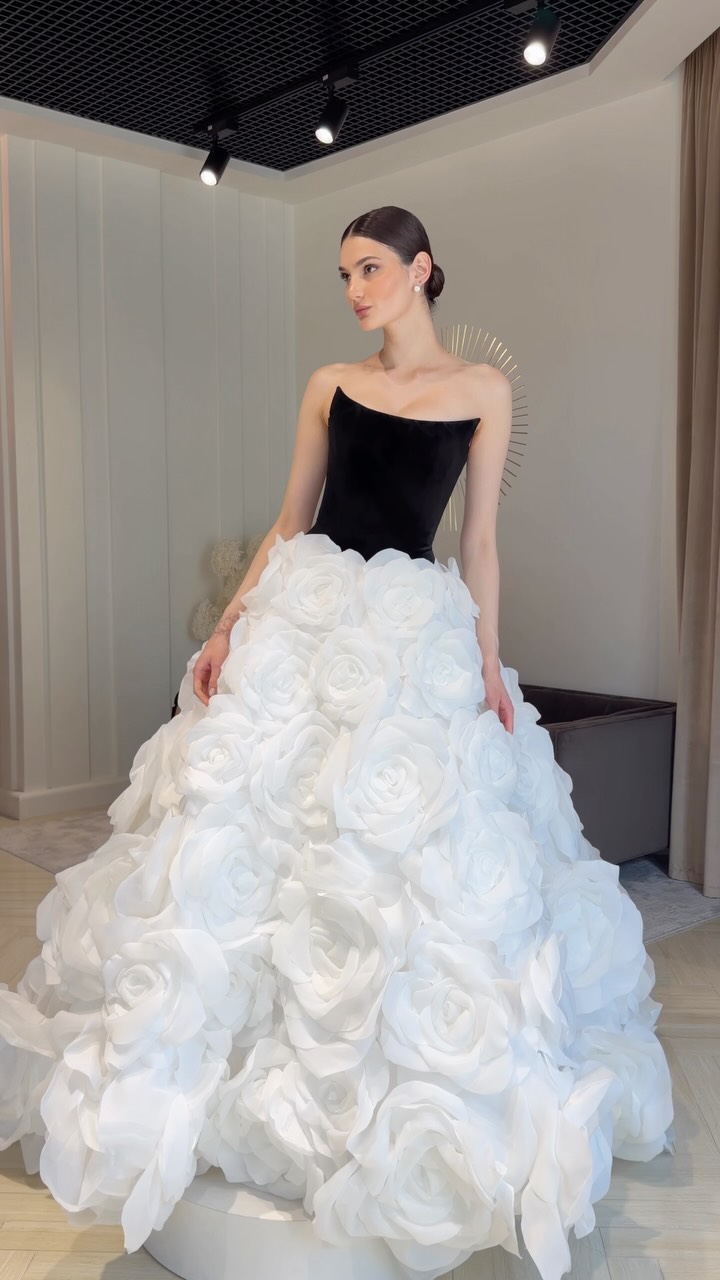 black and white corset wedding dress Meet OSCAR — a striking black-and-white ballgown with a sculpted velvet corset, a voluminous skirt adorned with handmade organza flowers, around 150 hours of handwork behind its intricate floral elegant black and white wedding dresses