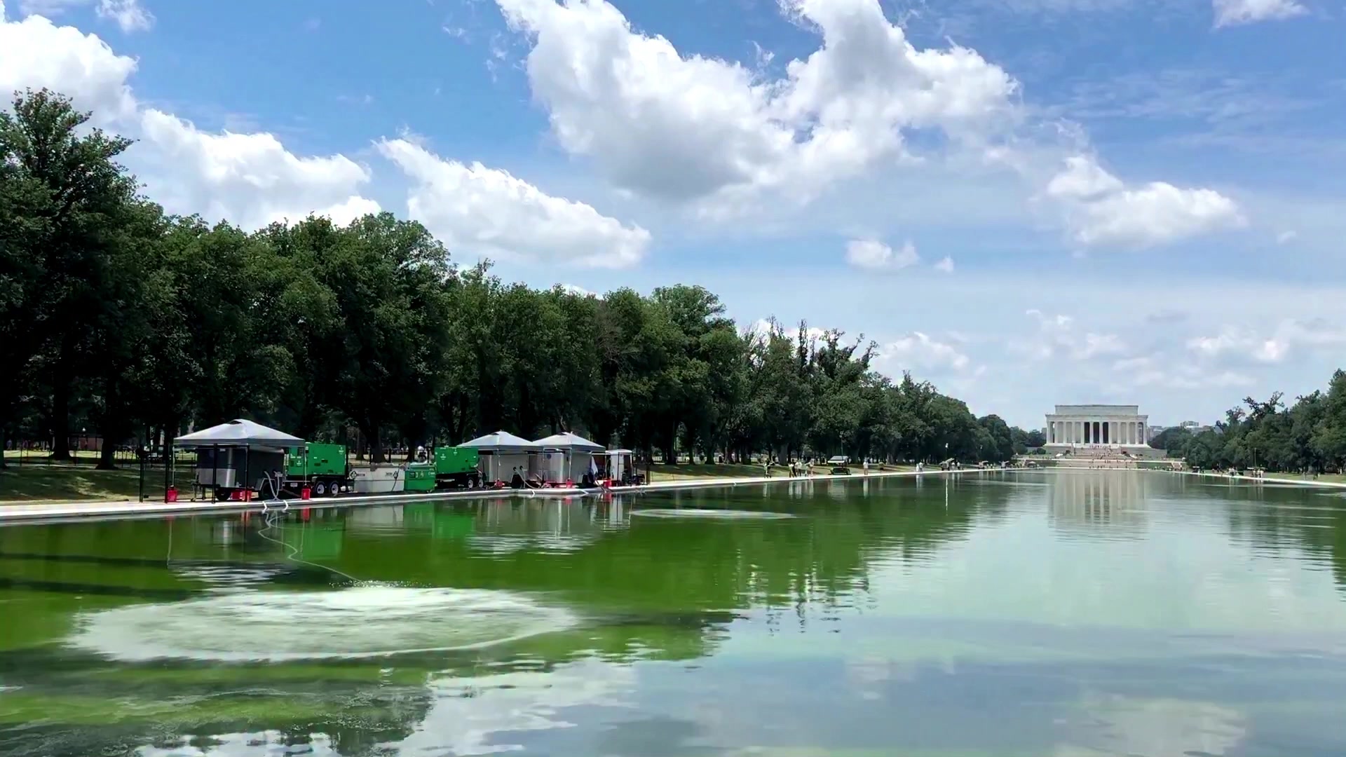 The reflecting pool appeared green just days after President