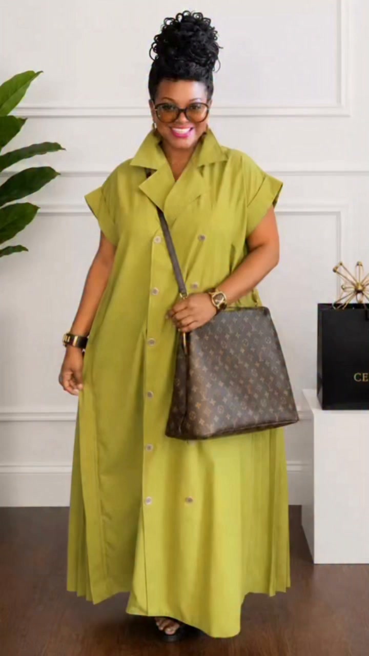 The Olive Elegance Pleated Maxi Dress features a collared neckline, button-front closure, short cap sleeves, and a pleated back for added movement. Its relaxed, flowy silhouette and full maxi length 