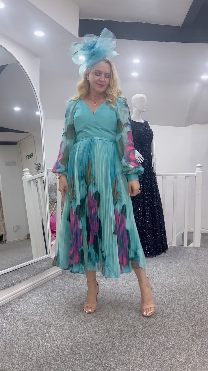 turquoise green dress combination Make an entrance they’ll remember… 💙✨, Say hello to this stunning beauty! 💐 The elegant pleated skirt, beautiful floral detailing and dramatic sheer sleeves create the perf women's dress