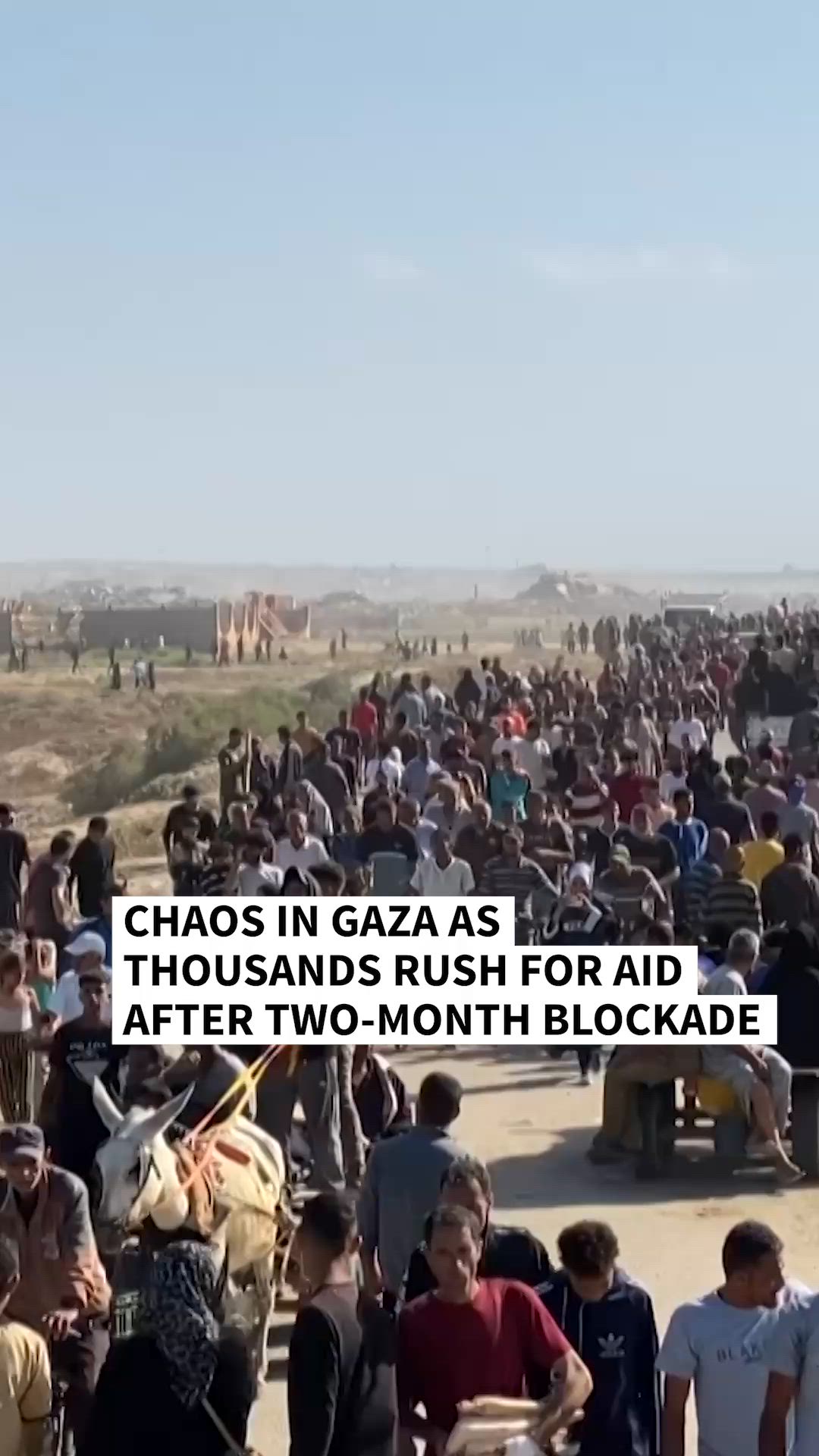 Thousands of Palestinians rushed into a new aid distribution centre run ...