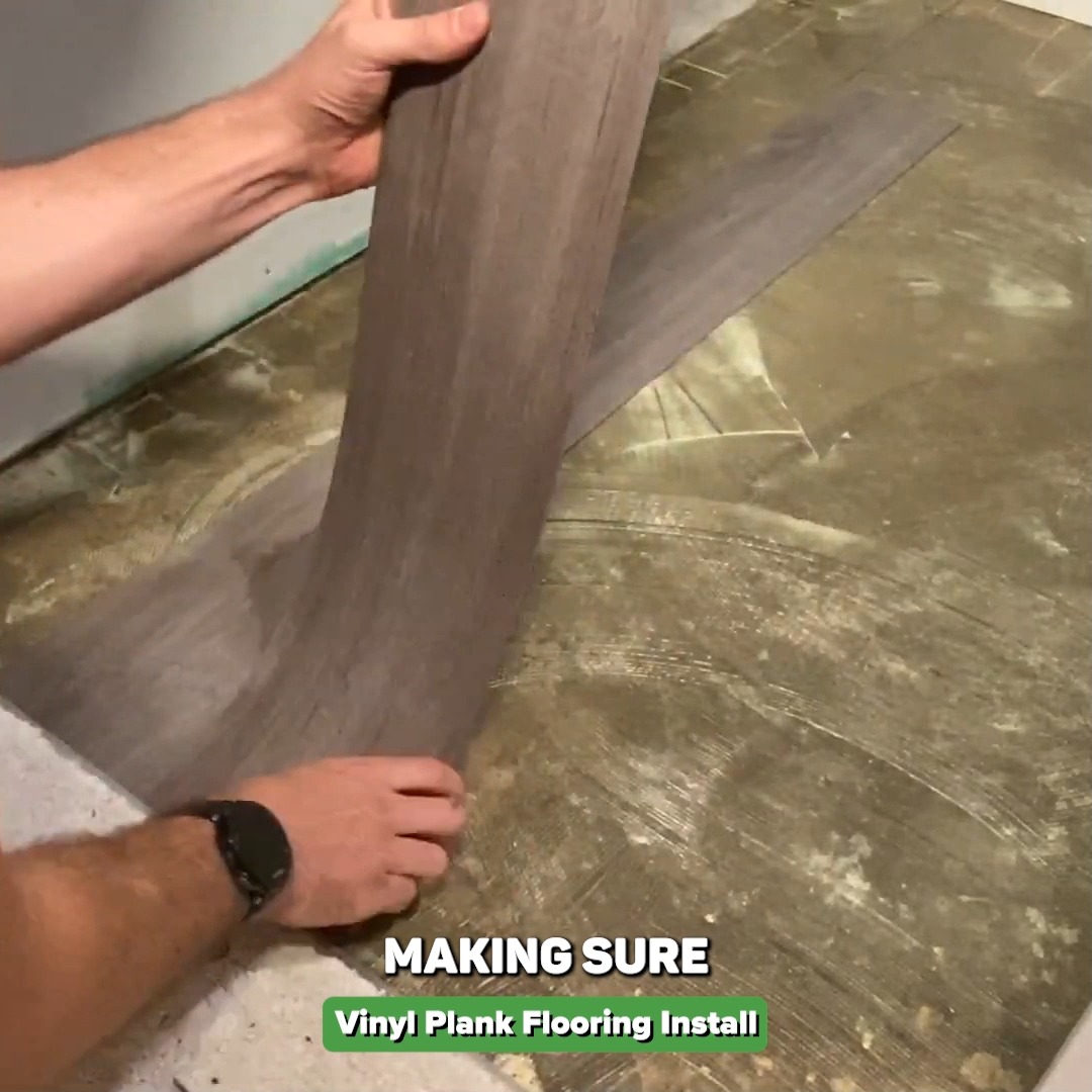 Installing glue-down vinyl plank flooring on a bathroom concrete floor ...