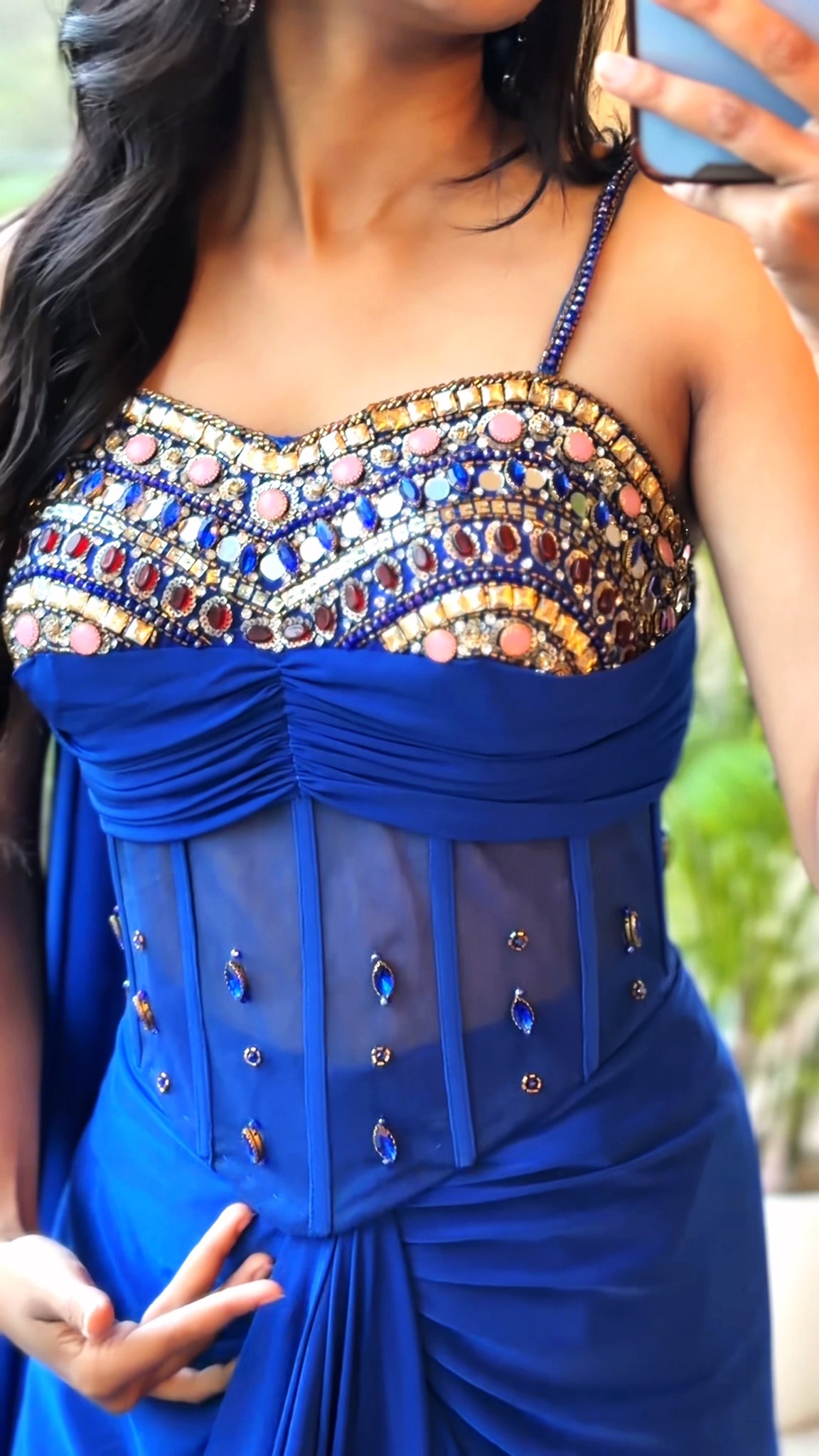 Draped in drama, detailed to dazzle. 💙✨, A statement Indo-Western that knows exactly how to own the room. The sculpted corset, intricate mirror and stone detailing, fluid drapes and dramatic fall come 