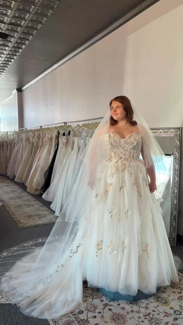 🕊️ Featured Dress Friday 🕊️, Petal by @morileeofficial is a flowy A-line silhouette with 3d florals throughout. The sweetheart bodice consists of colorful pearl and crystal beading along with 