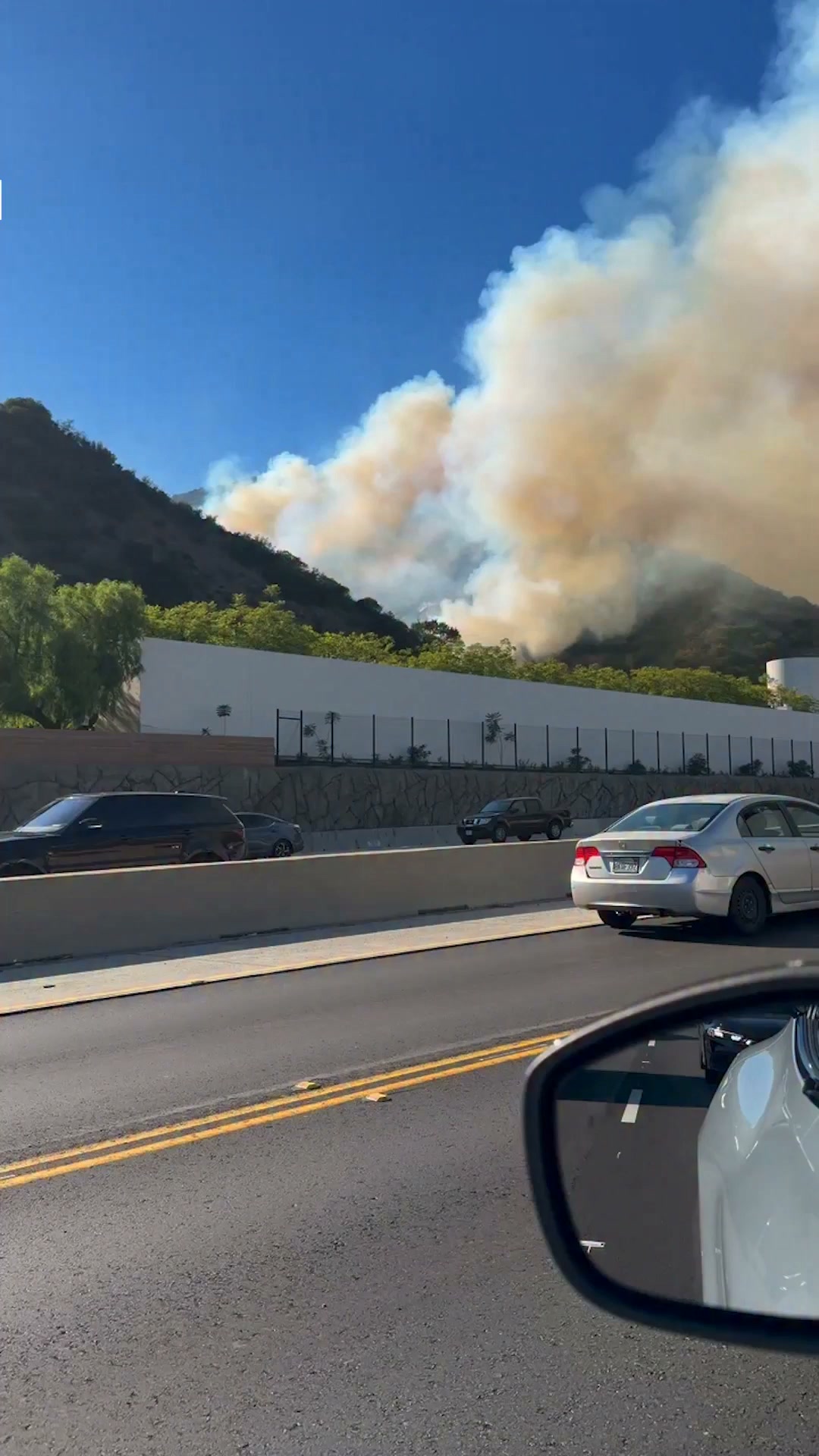 A brush fire erupted Wednesday afternoon near the Getty Center and