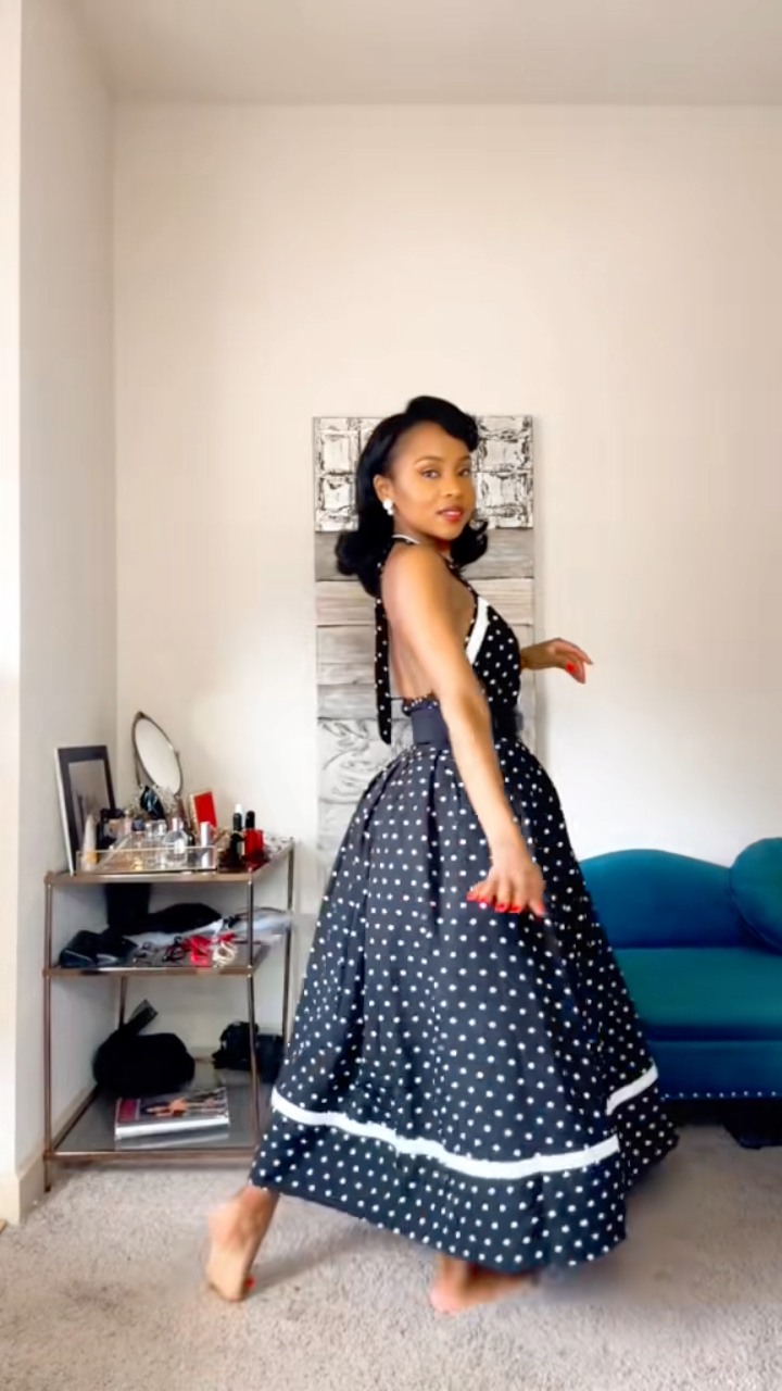 A very stylish polka dot 1950s inspired halter neck dress. With a structured bodice and cinched waist to create that infamous 50s silhouette. Fun fact: In the 1950s, women often wore petticoats 