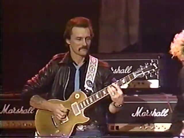 Brian Setzer and Dickey Betts playing together at the Guitar