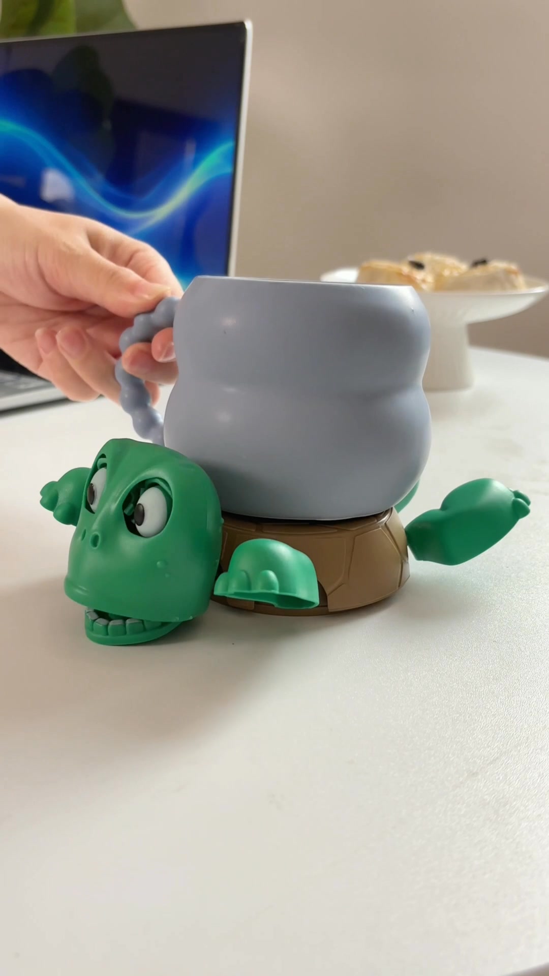 This turtle-shaped coaster keeps drinks in place and adds a splash of ...
