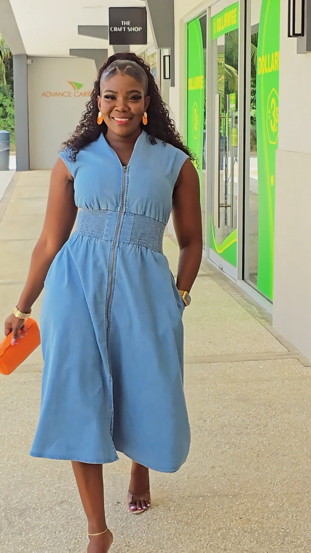 navy dress with green accessories Denim days in ‘Wendia’ 💙 A sleeveless midi featuring a front zip, smocked waist, side pockets, and a flared skirt. Pair it heels and statement to dress it up, MOG Dress with Sleeves