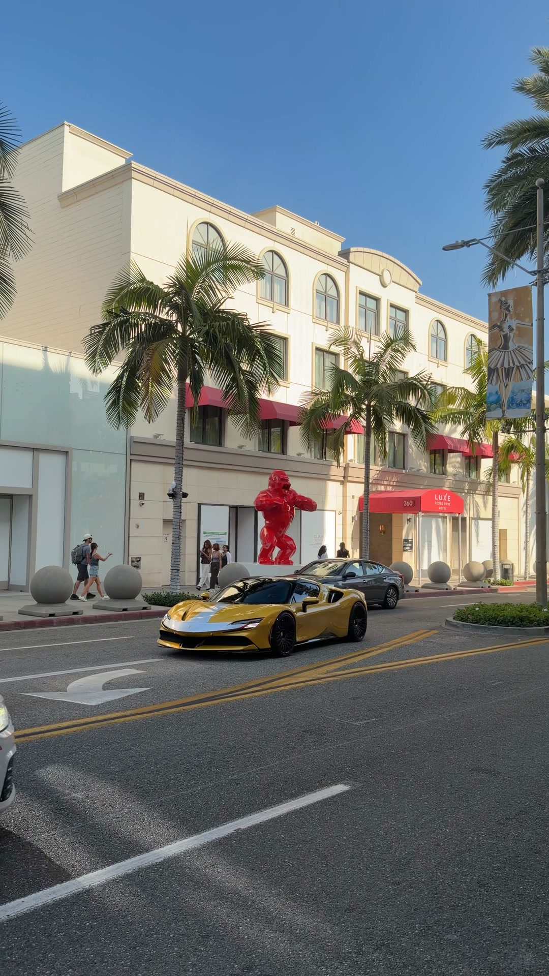 A Ferrari SF90 Spider was spotted gliding down Rodeo Drive, showcasing ...