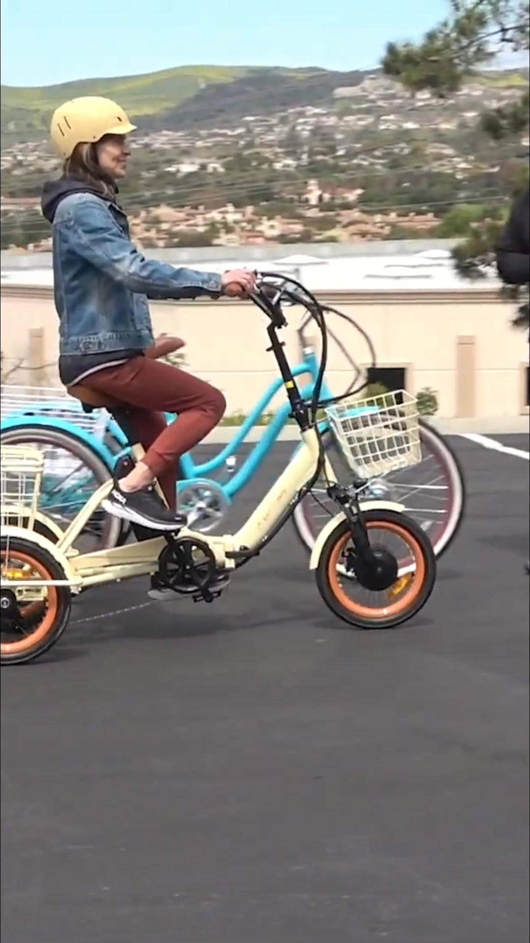 A person enjoys a smooth ride on the cream-colored Sixthreezero ...