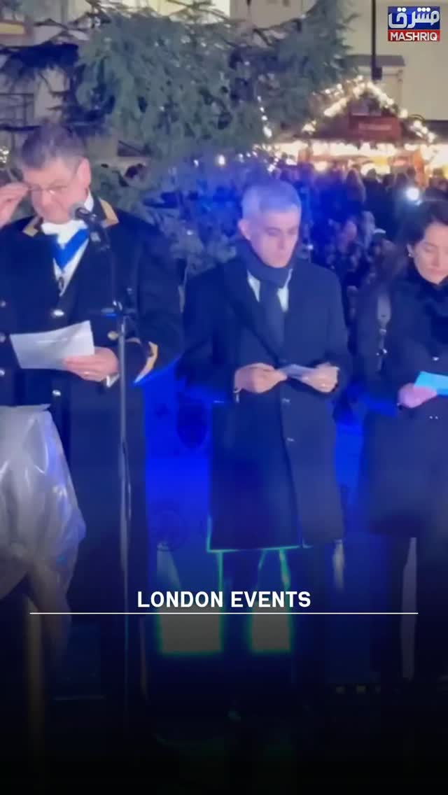 During a Christmas carol event in London, Mayor Sadiq Khan briefly ...