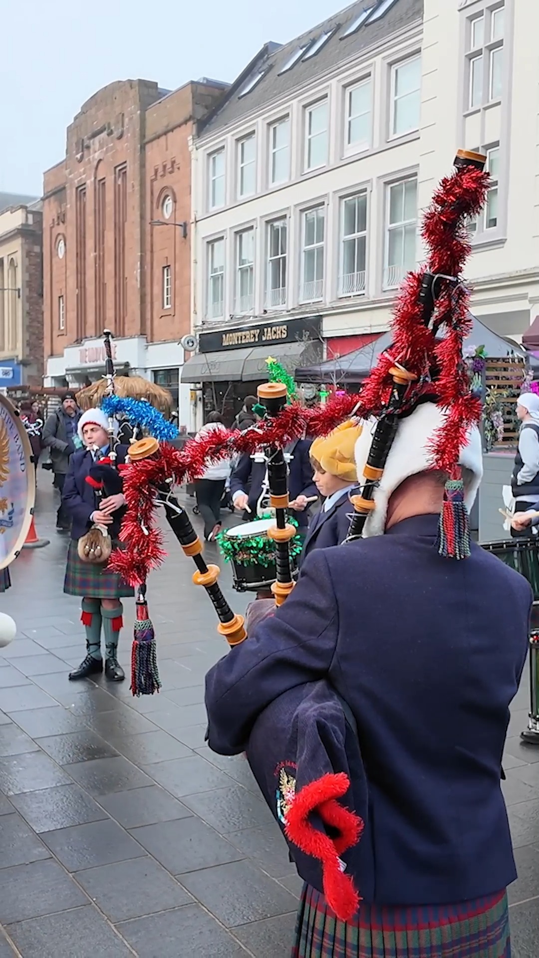 A festive Perth & District Pipe Band, playing Scotland the Brave into ...