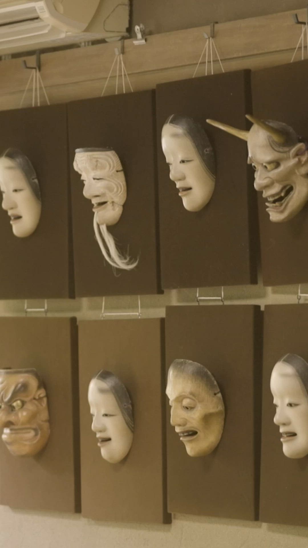 Depicting the three stages of carving a Noh mask, these hinoki
