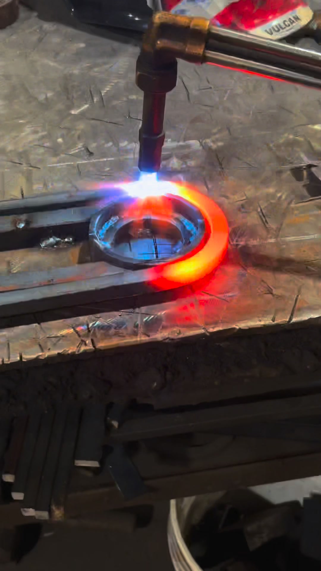 Using a torch to heat and shape steel for a custom iron design — strong ...