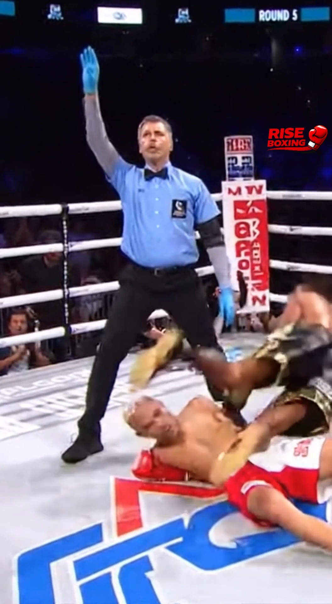 The boxer throws a confident move, but suddenly loses balance and falls ...