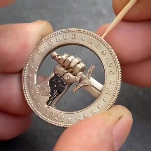 An unusual 1-dollar coin with a secret mechanism That makes the