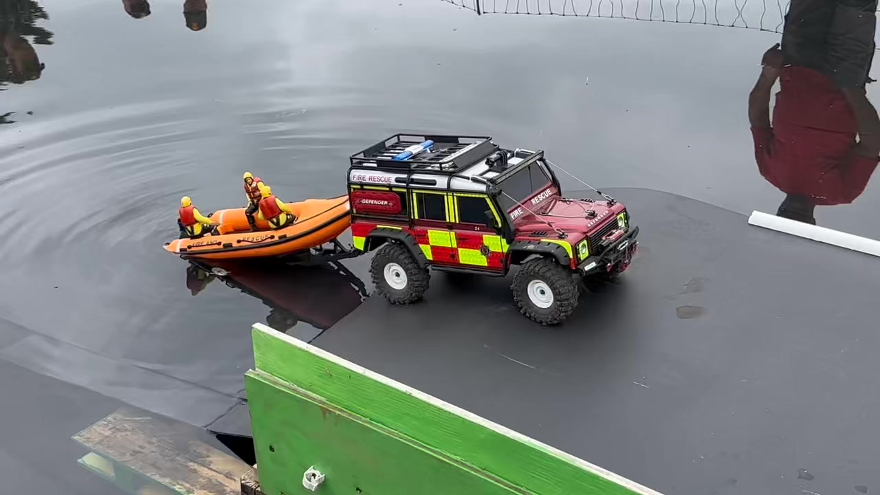 Rescue RIB being launched by the Fire and Recuse Land Rover Defender ...