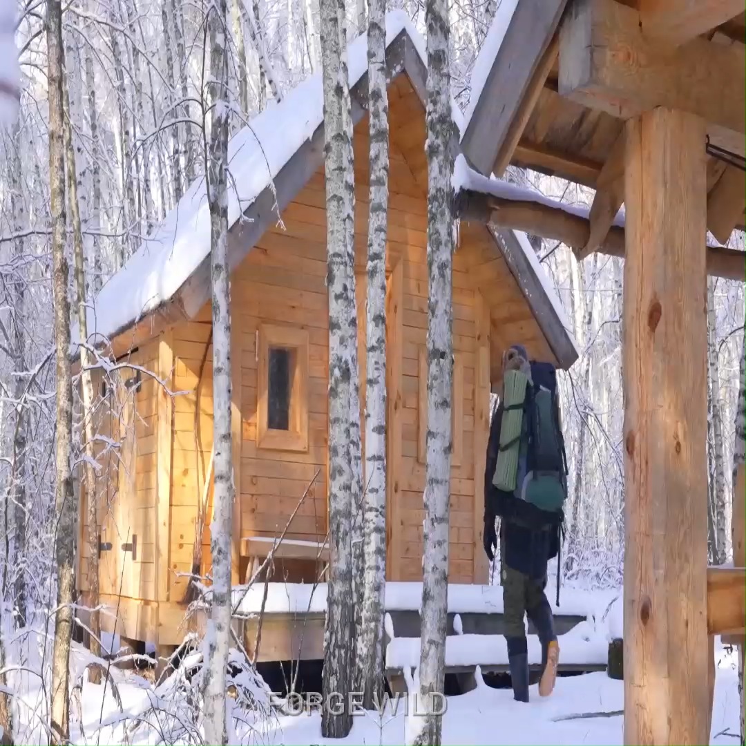 Overnight at −18°C in a frozen wilderness log cabin with a new wooden ...