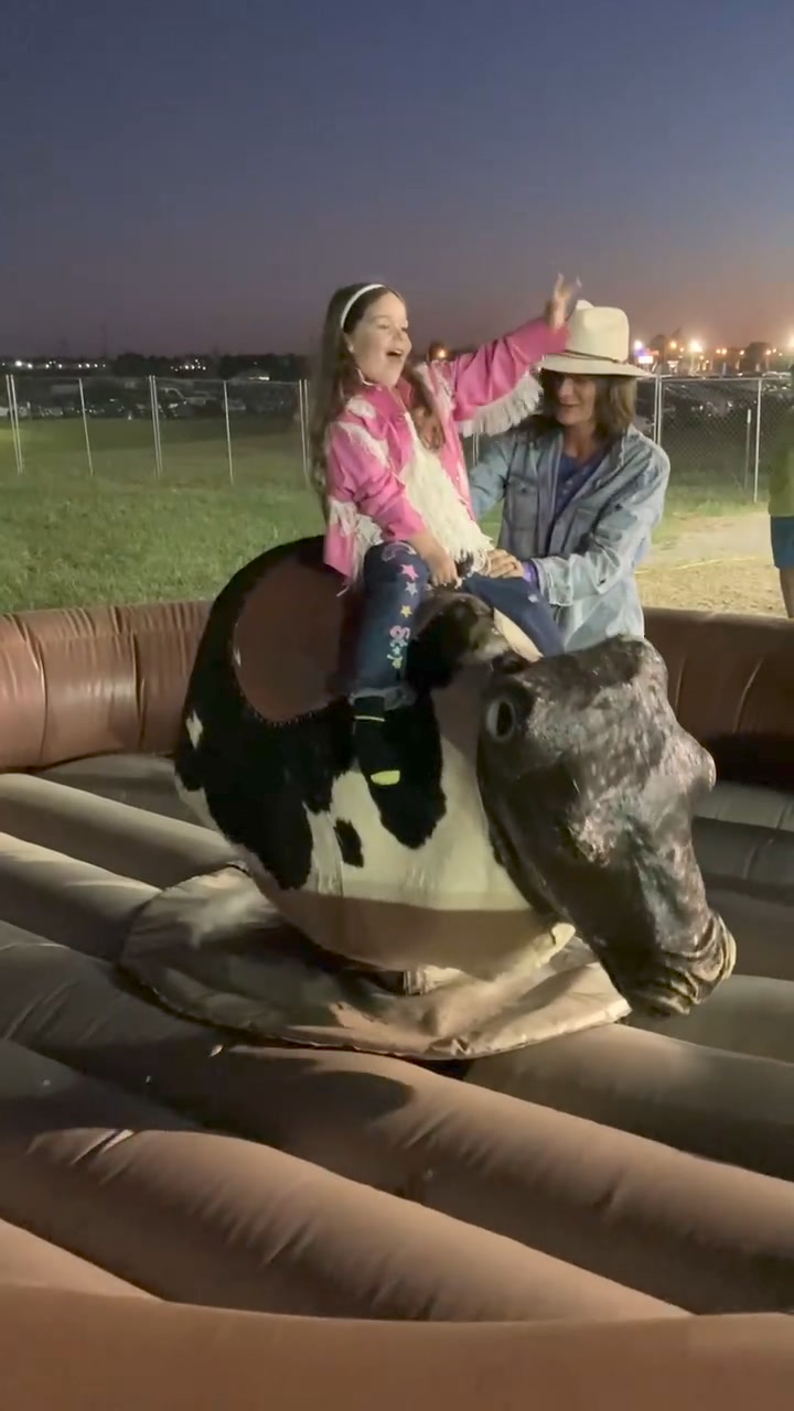 Lily riding the Bull at the Bulls and Barrels rodeo Saturday night ...