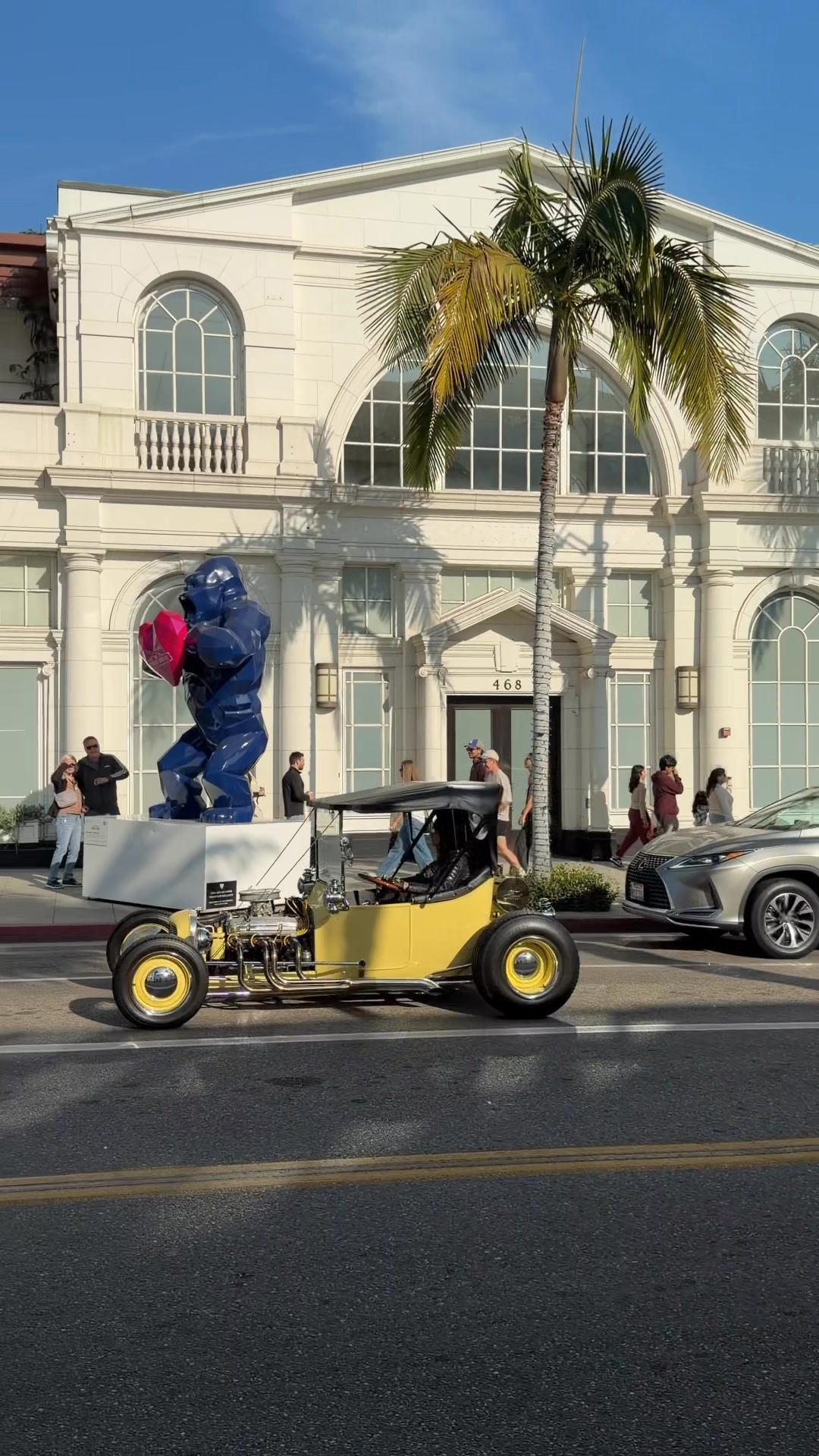 A classic hot rod cruising down Rodeo Drive, blending old-school ...
