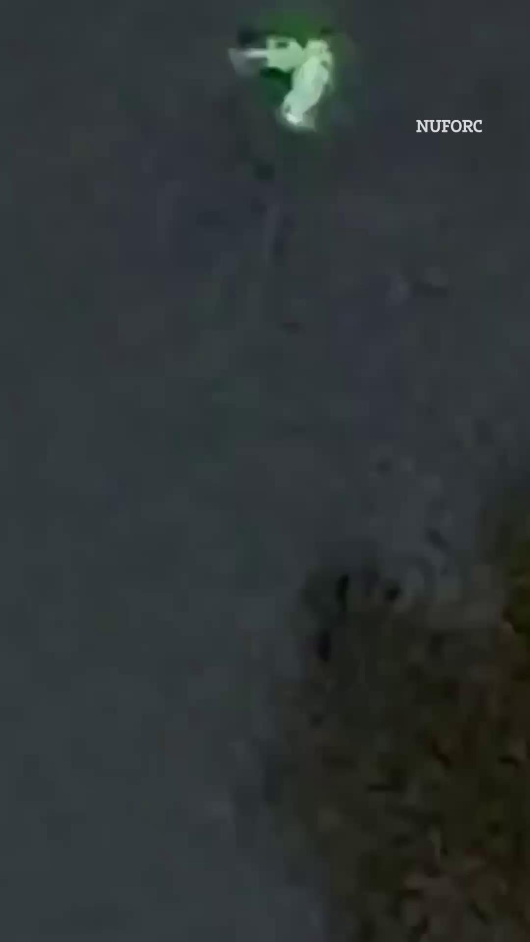Haunting moment mysterious V-shaped UFO hovers over city | The US