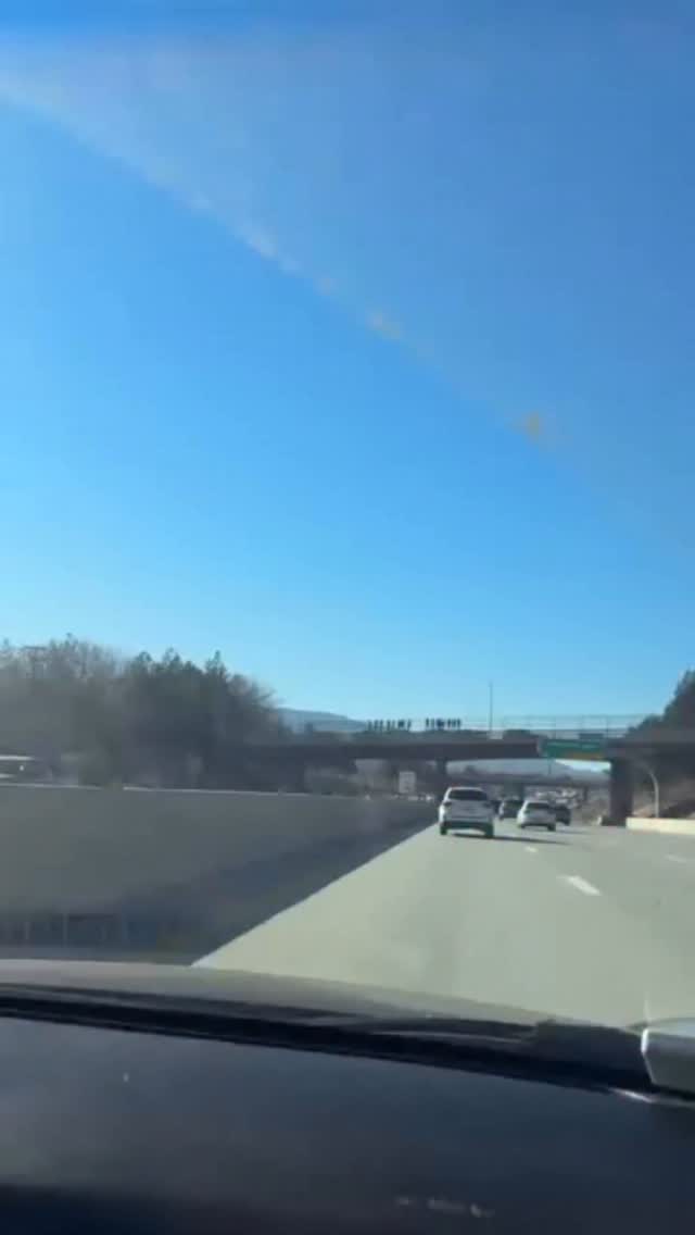 There are multiple firefighter tributes above the highway right now it ...
