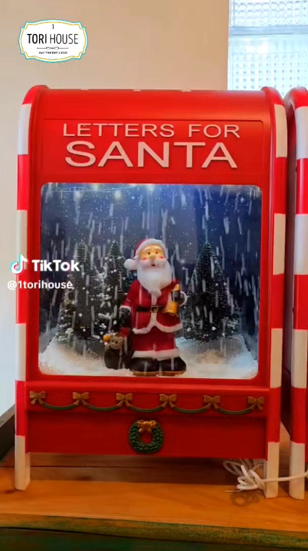 A delightful Santa letter box that lights up, snows, and plays
