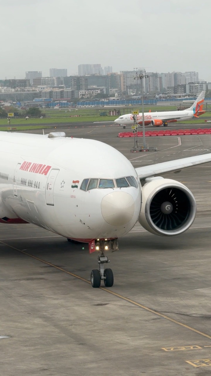 An Air India Boeing 777-300ER is seen taxiing to its gate at