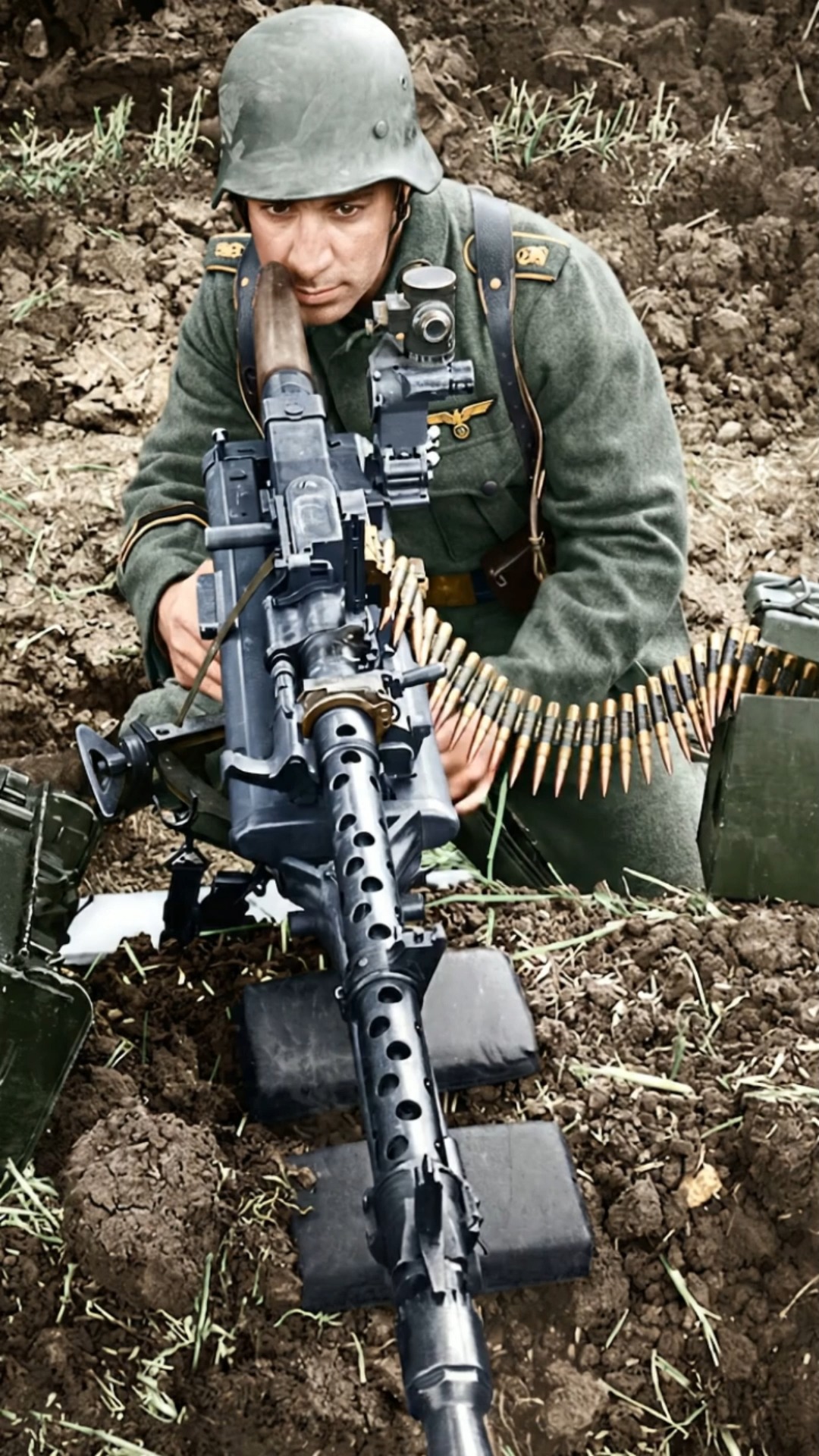 A German soldier armed with an MG34 machine gun fitted with an