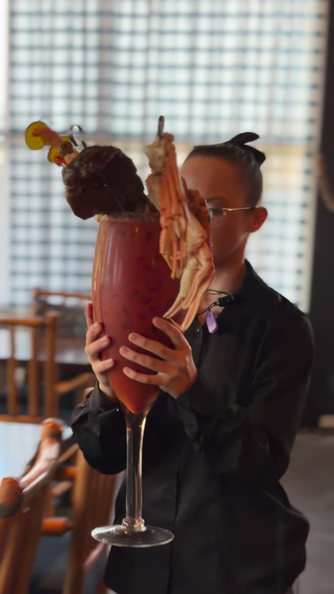 The Ozarks Surf & Turf Bloody Mary featuring 1lb of Crab Legs, a