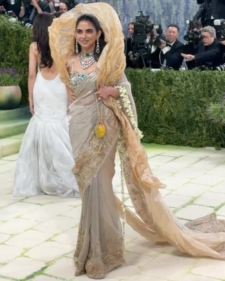 isha ambani gold dress in custom Gaurav Gupta Couture for the Met Gala 2026. In response to the theme Fashion is Art, the look is conceived as a study of the dressed body, where art is not applied, but lived., open toe
