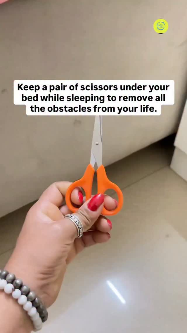 Placing a pair of scissors under the bed as a symbol, cutting ties with ...
