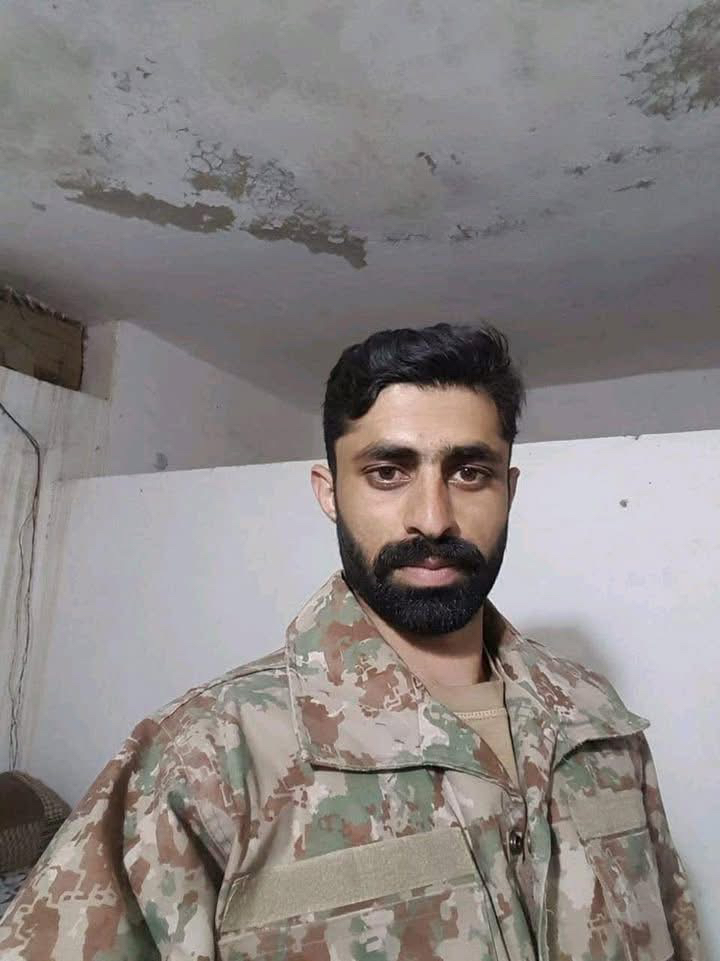 DG ISPR embraced the father of Major Atif Khalil Shaheed, during ...