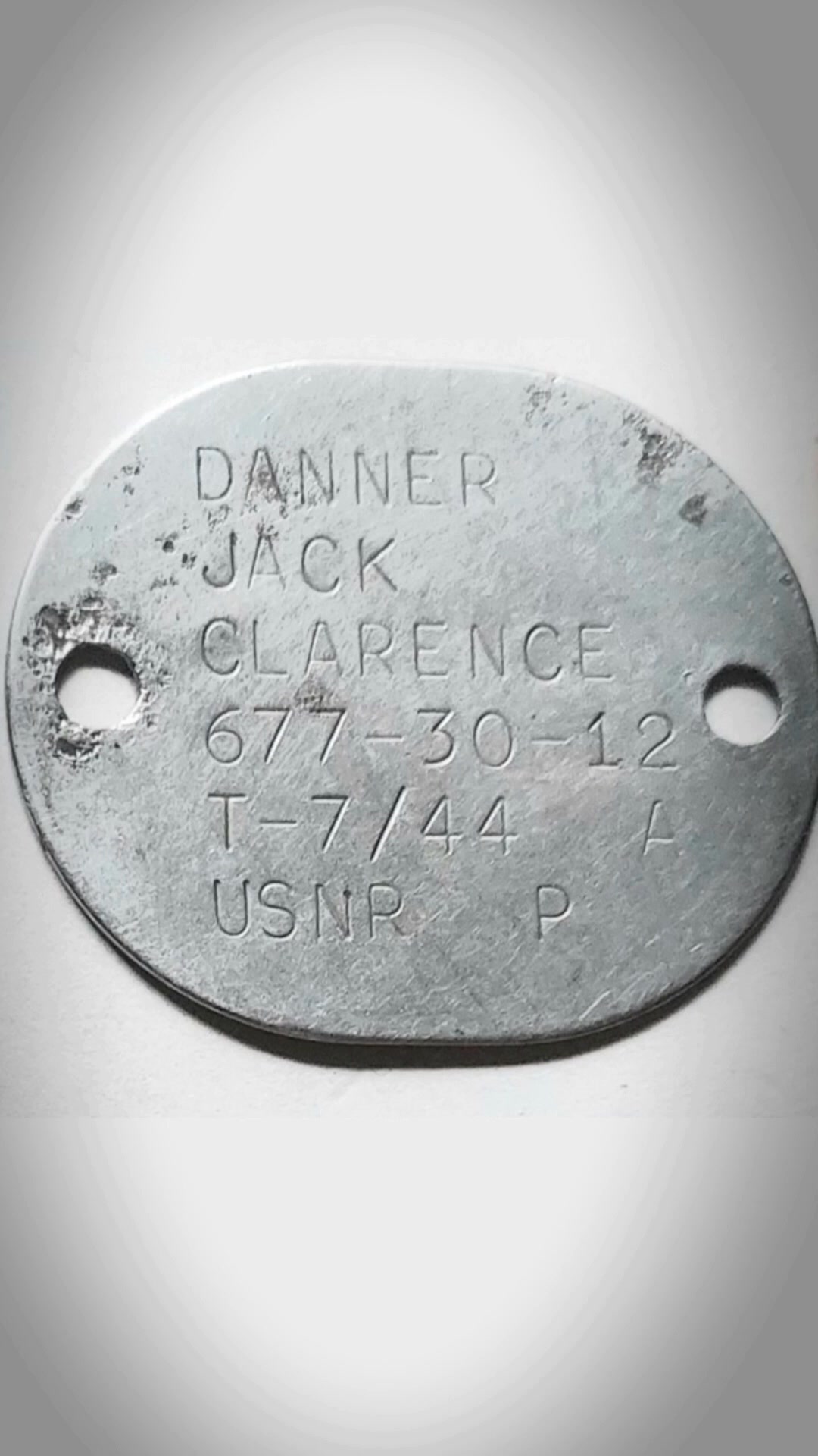 A WWII veteran's dog tags are returned to his son, decades after