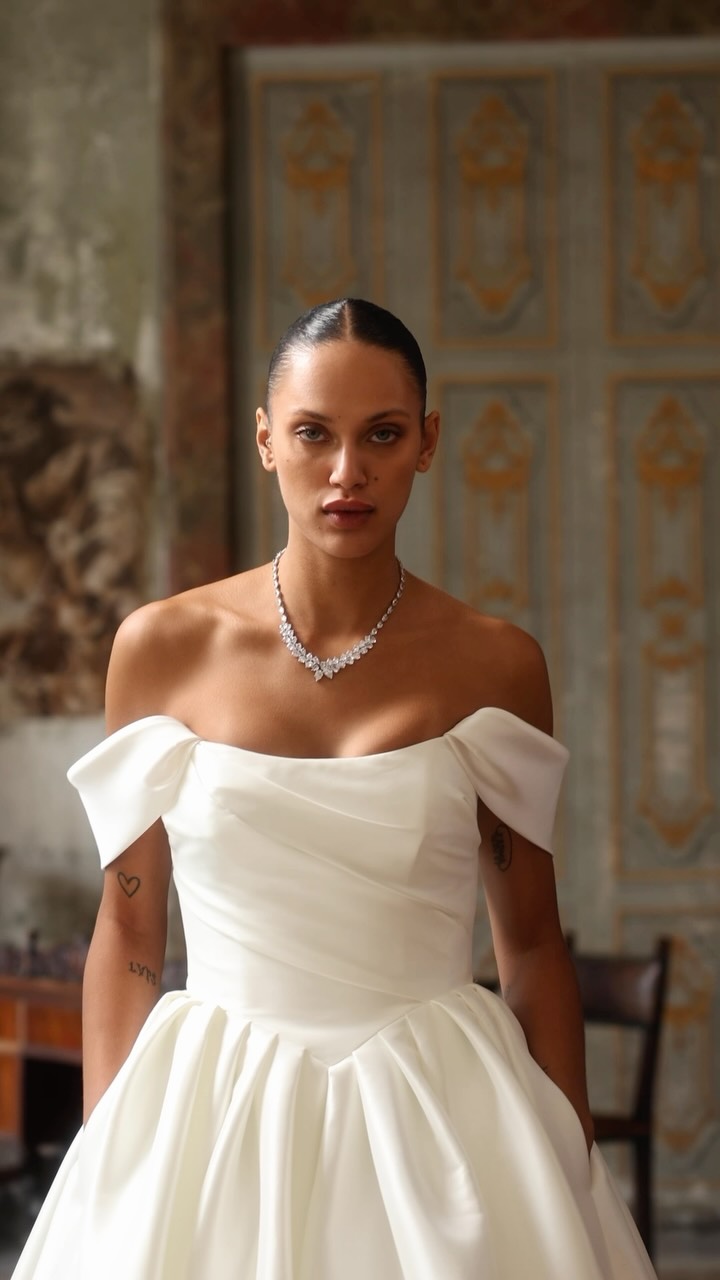 Let Kelsey do the talking👀…, Kelsey by Justin Alexander is a dramatic, classic stretch Mikado ball gown., It features a strapless scoop neckline, a texture rich ruched bodice, a structured drop basque 