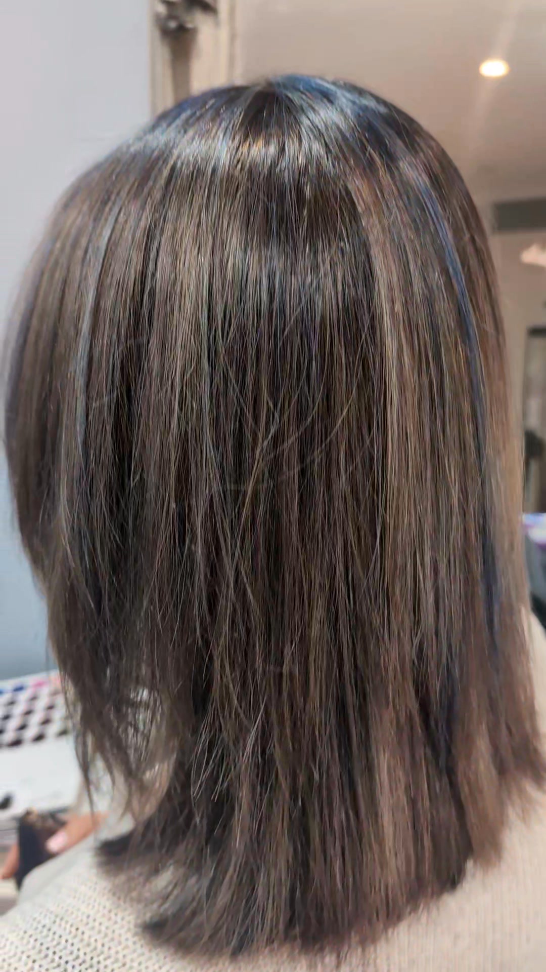 The natural dark gray-brown hair color is infused with blue highlights ...