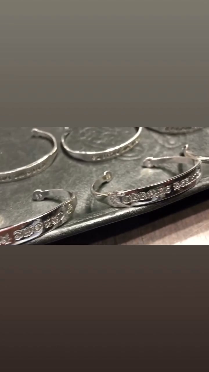 Features detailed cross‑flower engraving on lobster snap and chain