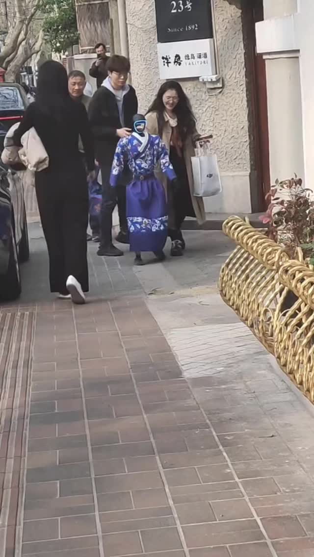 A human-like robot was spotted walking through the streets in China ...