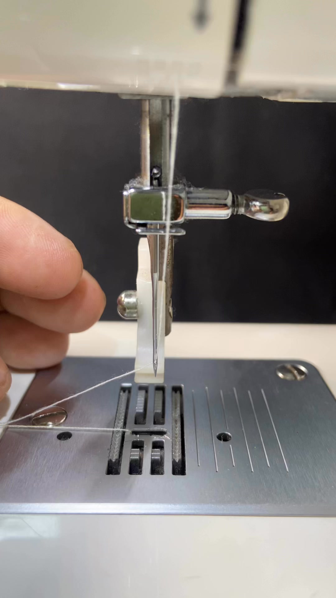 A simple and correct way to install a needle on a portable sewing ...