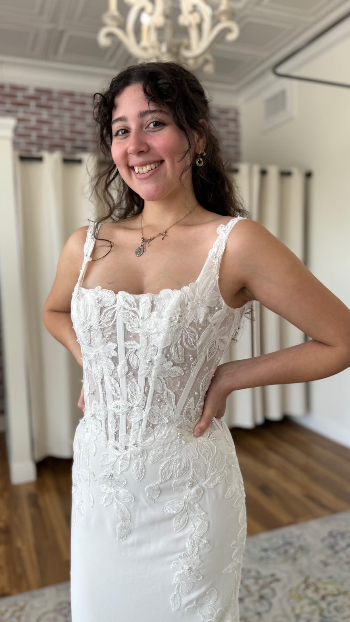 Romantic. Sculpted. Unapologetically Bridal., Delicate floral lace and pearl beading trail from the bust down, cascading into a gorgeous & dramatic lace-edged train. The structured bodice gives this 